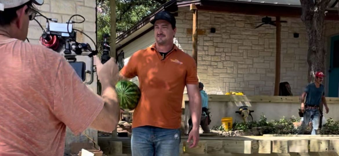 Behind-the-scenes of a video marketing production in Austin, Texas, showcasing a contractor on camera with a film crew recording.